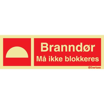 Branndør - "Må ikke blokkeres", 30x10 cm.